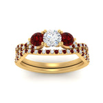 Load image into Gallery viewer, round-cut-twisted-floral-prong-ruby-wedding-set-in-yellow-gold-FD10257ROGRUDR-ANGLE5-NL-YG_6b8b37c0-db10-43e2-9f66-d32f5b648e1b?v=1756360189
