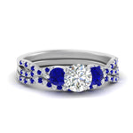Load image into Gallery viewer, round-cut-twisted-floral-prong-sapphire-wedding-set-in-white-gold-FD10257ROGSABL-NL-WG_a3e76c3e-6f83-4536-b79c-4802c287e5f5?v=1756360188
