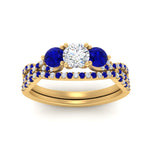 Load image into Gallery viewer, round-cut-twisted-floral-prong-sapphire-wedding-set-in-yellow-gold-FD10257ROGSABL-ANGLE5-NL-YG_9816fe7f-4c15-4bac-b644-8550853c1990?v=1756360188
