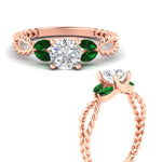 Load image into Gallery viewer, round-cut-twisted-leaf-emerald-split-engagement-ring-in-rose-gold-fdenr1084gemgrangle3-nl-rg_370cbe48-cf90-4659-9d5c-5082b2069d14.jpg?v=1764581107
