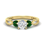 Load image into Gallery viewer, round-cut-twisted-leaf-emerald-split-engagement-ring-in-yellow-gold-fdenr1084gemgrsleep-nl-yg_5640e79b-0f22-417f-a8b2-f5bbe29a7ba7.jpg?v=1764581108
