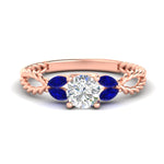 Load image into Gallery viewer, round-cut-twisted-leaf-sapphire-split-engagement-ring-in-rose-gold-fdenr1084gsablsleep-nl-rg.jpg?v=1764581094
