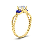 Load image into Gallery viewer, round-cut-twisted-leaf-sapphire-split-engagement-ring-in-yellow-gold-fdenr1084gsablangle2-nl-yg_85268173-492c-4705-9dc0-d5c964ebeda5.jpg?v=1764581107

