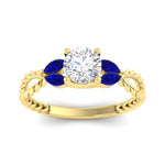 Load image into Gallery viewer, round-cut-twisted-leaf-sapphire-split-engagement-ring-in-yellow-gold-fdenr1084gsablangle5-nl-yg_51461a81-75d5-455d-b2a4-ec2fcbc34685.jpg?v=1764581107
