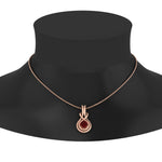 Load image into Gallery viewer, round-ruby-solitaire-infinity-knot-pendant-in-rose-gold
