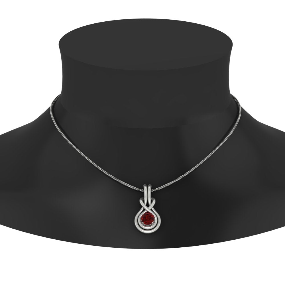 round-ruby-solitaire-infinity-knot-pendant-in-white-gold