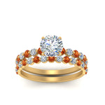 Load image into Gallery viewer, shared-prong-round-engagement-and-wedding-ring-set-with-orange-sapphire-in-FDENS3023ROGSAOR-NL-YG
