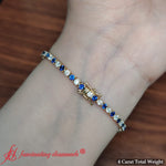 Load image into Gallery viewer, tennis-diamond-bracelet-4-carat-with-sapphire-in-18k-yellow-gold-fdbrc8635ro-4-00-ct-1
