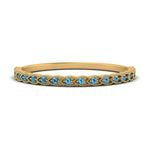 Load image into Gallery viewer, thin-floral-stacking-blue-topaz-band-in-yellow-gold-FD123085B2GICBLTOANGLE3-NL-YG-GS.jpg

