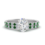 Load image into Gallery viewer, three-quarter-oval-shaped-diamond-gallery-bridal-ring-set-with-emerald-in-FD9168OVGEMGRANGLE3-NL-WG
