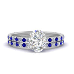 Load image into Gallery viewer, three-quarter-oval-shaped-diamond-gallery-bridal-ring-set-with-sapphire-in-FD9168OVGSABLANGLE3-NL-WG
