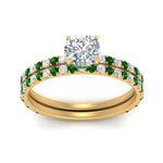Load image into Gallery viewer, three-quarter-round-cut-diamond-gallery-bridal-ring-set-with-emerald-in-FD9168ROGEMGRANGLE3-NL-YG