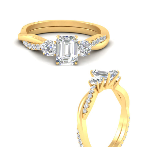 three-stone-twisted-emerald-cut-vine-diamond-engagement-ring-in-yellow-gold-fdens3301emrangle3-nl-yg.jpg