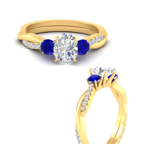 three-stone-twisted-oval-shaped-vine-sapphire-engagement-ring-in-yellow-gold-fdens3301ovrgsablangle3-nl-yg.jpg