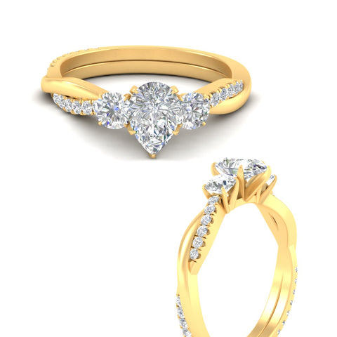 three-stone-twisted-pear-shaped-vine-diamond-engagement-ring-in-yellow-gold-fdens3301perangle3-nl-yg.jpg