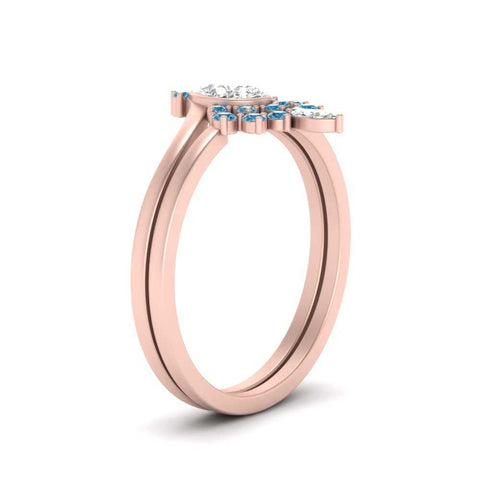 tiara-pear-bezel-blue-topaz-wedding-ring-set-in-rose-gold-FD1046PEGICBLTOANGLE2-NL-RG?v=1761911422