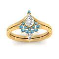 Thumbnail 90 - tiara-pear-bezel-blue-topaz-wedding-ring-set-in-yellow-gold-FD1046PEGICBLTOANGLE5-NL-YG?v=1761911422
