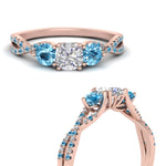 Load image into Gallery viewer, trellis-twisted-3-stone-cushion-cut-diamond-ring-blue-topaz-in-rose-gold-FD123699CURGICBLTOANGLE3-NL-RG?v=1756181617

