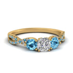 Load image into Gallery viewer, trellis-twisted-3-stone-cushion-cut-diamond-ring-blue-topaz-in-yellow-gold-FD123699CURGICBLTO-NL-YG_eafb4518-2a84-4cd3-b424-6ebdd8d4248f?v=1756181824
