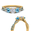Load image into Gallery viewer, trellis-twisted-3-stone-cushion-cut-diamond-ring-blue-topaz-in-yellow-gold-FD123699CURGICBLTOANGLE3-NL-YG?v=1756181616