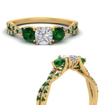 Load image into Gallery viewer, trellis-twisted-3-stone-cushion-cut-diamond-ring-with-emerald-in-yellow-gold-FD123699CURGEMGRANGLE3-NL-YG_eb909523-451b-45f4-a2d5-1ccf32195cb6?v=1756181824

