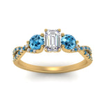 Load image into Gallery viewer, trellis-twisted-3-stone-emerald-cut-diamond-ring-blue-topaz-in-yellow-gold-FD123699EMRGICBLTOANGLE5-NL-YG?v=1756181639
