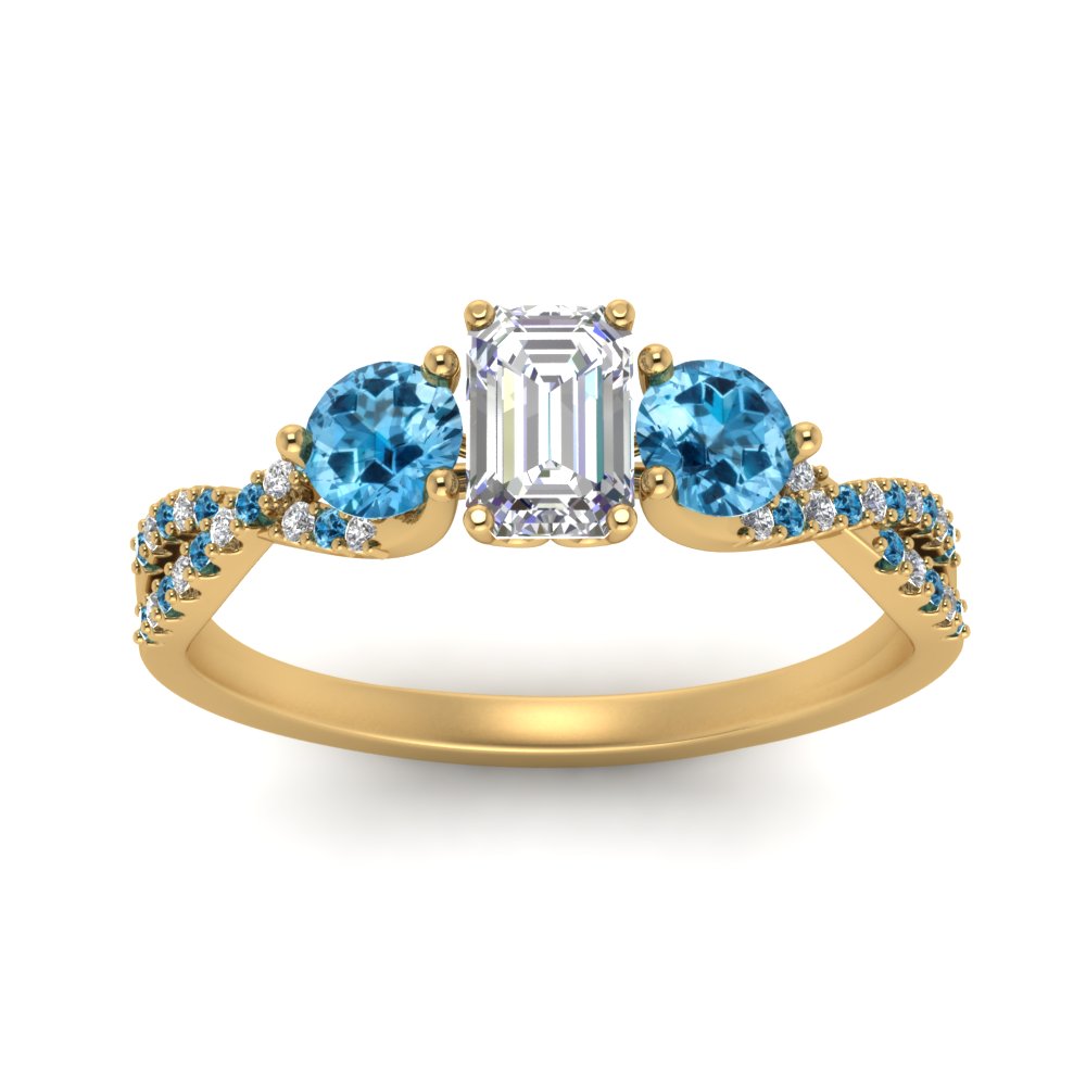 trellis-twisted-3-stone-emerald-cut-diamond-ring-blue-topaz-in-yellow-gold-FD123699EMRGICBLTOANGLE5-NL-YG_85e04d64-1088-4cd4-91d3-a3ad40ecd5c4?v=1756181838