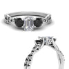 Load image into Gallery viewer, trellis-twisted-3-stone-emerald-cut-diamond-ring-with-black-diamond-in-white-gold-FD123699EMRGBLACKANGLE3-NL-WG_bc5ed416-7870-4fb0-ab55-224493f39361?v=1756181838