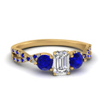 Load image into Gallery viewer, trellis-twisted-3-stone-emerald-cut-diamond-ring-with-sapphire-in-yellow-gold-FD123699EMRGSABL-NL-YG?v=1756181638
