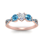 Load image into Gallery viewer, trellis-twisted-3-stone-heart-shaped-diamond-ring-blue-topaz-in-rose-gold-FD123699HTRGICBLTOANGLE5-NL-RG_10c5d4fb-5371-43c4-9a11-d500f71ee81a?v=1756181851
