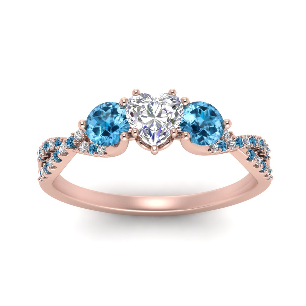 trellis-twisted-3-stone-heart-shaped-diamond-ring-blue-topaz-in-rose-gold-FD123699HTRGICBLTOANGLE5-NL-RG_10c5d4fb-5371-43c4-9a11-d500f71ee81a?v=1756181851