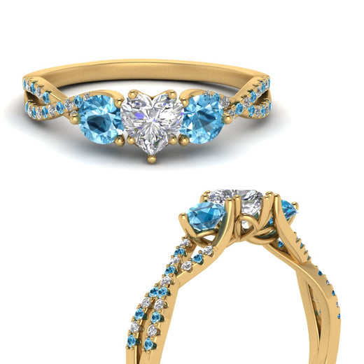 trellis-twisted-3-stone-heart-shaped-diamond-ring-blue-topaz-in-yellow-gold-FD123699HTRGICBLTOANGLE3-NL-YG_b6b772e0-2ef9-4823-a246-83b9f9924a2a?v=1756181851