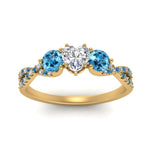 Load image into Gallery viewer, trellis-twisted-3-stone-heart-shaped-diamond-ring-blue-topaz-in-yellow-gold-FD123699HTRGICBLTOANGLE5-NL-YG?v=1756181662
