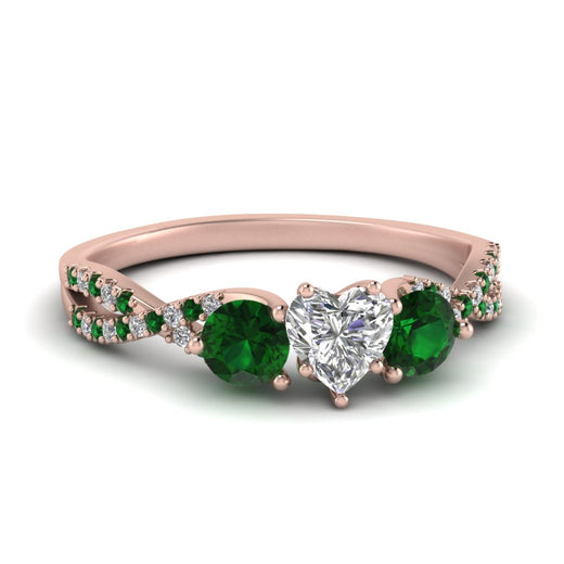 trellis-twisted-3-stone-heart-shaped-diamond-ring-with-emerald-in-rose-gold-FD123699HTRGEMGR-NL-RG_0198aa37-9e5d-49cf-af4e-b3761aa2159e?v=1756181852