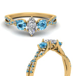 Load image into Gallery viewer, trellis-twisted-3-stone-marquise-cut-diamond-ring-blue-topaz-in-yellow-gold-FD123699MQRGICBLTOANGLE3-NL-YG_9315f664-aa56-45c3-a036-328449949530?v=1756181864

