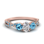 Load image into Gallery viewer, trellis-twisted-3-stone-oval-shaped-diamond-ring-blue-topaz-in-rose-gold-FD123699OVRGICBLTO-NL-RG_a688d924-f0b8-4d2f-924f-adc5970de240?v=1756181876
