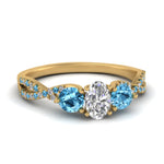 Load image into Gallery viewer, trellis-twisted-3-stone-oval-shaped-diamond-ring-blue-topaz-in-yellow-gold-FD123699OVRGICBLTO-NL-YG?v=1756181705
