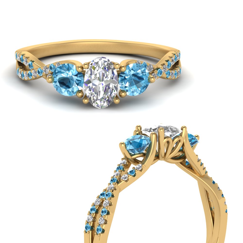 trellis-twisted-3-stone-oval-shaped-diamond-ring-blue-topaz-in-yellow-gold-FD123699OVRGICBLTOANGLE3-NL-YG?v=1756181706