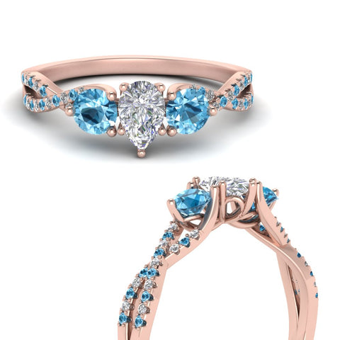 trellis-twisted-3-stone-pear-shaped-diamond-ring-blue-topaz-in-rose-gold-FD123699PERGICBLTOANGLE3-NL-RG?v=1756181726