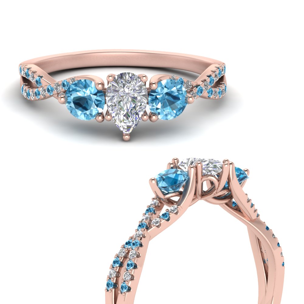 trellis-twisted-3-stone-pear-shaped-diamond-ring-blue-topaz-in-rose-gold-FD123699PERGICBLTOANGLE3-NL-RG_7b447dde-96fe-475e-9513-329c729e8c61?v=1756181892