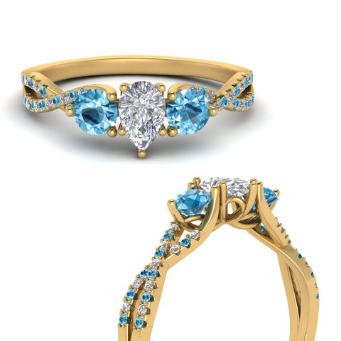 trellis-twisted-3-stone-pear-shaped-diamond-ring-blue-topaz-in-yellow-gold-FD123699PERGICBLTOANGLE3-NL-YG?v=1756181726