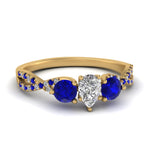 Load image into Gallery viewer, trellis-twisted-3-stone-pear-shaped-diamond-ring-with-sapphire-in-yellow-gold-FD123699PERGSABL-NL-YG_87b9c081-56d4-4b9c-813c-a0ee001e96bc?v=1756181891
