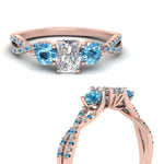 Load image into Gallery viewer, trellis-twisted-3-stone-radiant-cut-diamond-ring-blue-topaz-in-rose-gold-FD123699RARGICBLTOANGLE3-NL-RG_3cee265b-e8b5-409a-8d7e-2e507bc712c6?v=1756181919
