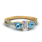Load image into Gallery viewer, trellis-twisted-3-stone-radiant-cut-diamond-ring-blue-topaz-in-yellow-gold-FD123699RARGICBLTO-NL-YG_29715328-d53e-4939-870f-c5a4f4035d3e?v=1756181919
