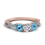 Load image into Gallery viewer, trellis-twisted-3-stone-round-cut-diamond-ring-blue-topaz-in-rose-gold-FD123699RORGICBLTO-NL-RG_4cea9de9-ff19-40e1-b743-c54c8d8b45d3?v=1756181932
