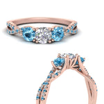 Load image into Gallery viewer, trellis-twisted-3-stone-round-cut-diamond-ring-blue-topaz-in-rose-gold-FD123699RORGICBLTOANGLE3-NL-RG?v=1756181788
