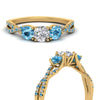 Load image into Gallery viewer, trellis-twisted-3-stone-round-cut-diamond-ring-blue-topaz-in-yellow-gold-FD123699RORGICBLTOANGLE3-NL-YG?v=1756181788