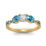 Load image into Gallery viewer, trellis-twisted-3-stone-round-cut-diamond-ring-blue-topaz-in-yellow-gold-FD123699RORGICBLTOANGLE5-NL-YG?v=1756181788
