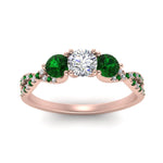 Load image into Gallery viewer, trellis-twisted-3-stone-round-cut-diamond-ring-with-emerald-in-rose-gold-FD123699RORGEMGRANGLE5-NL-RG_7e565757-80be-41c4-a470-1702d164536b?v=1756181932
