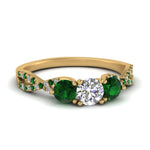 Load image into Gallery viewer, trellis-twisted-3-stone-round-cut-diamond-ring-with-emerald-in-yellow-gold-FD123699RORGEMGR-NL-YG?v=1756181788
